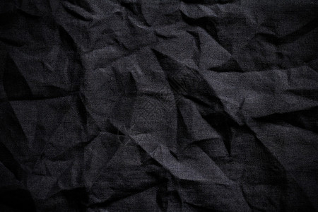 服装生产材料深黑布面背景图片