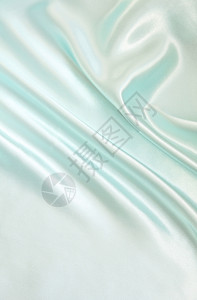自然平滑优雅的蓝色丝绸可用作背景柔软的丝滑图片
