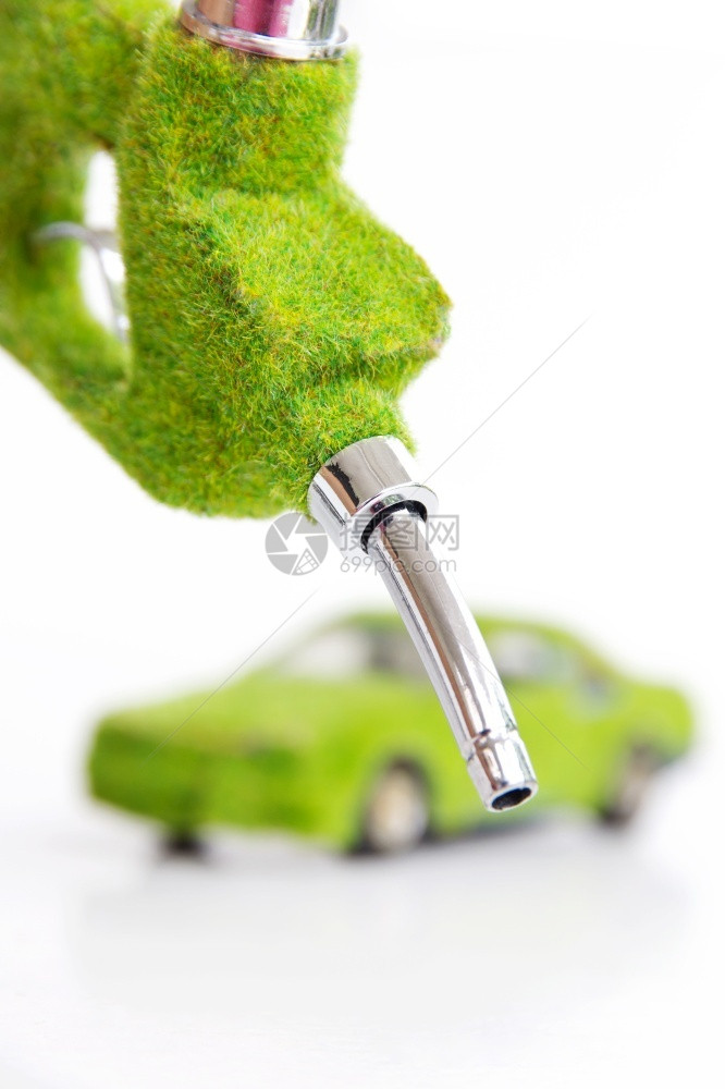 夹持绿色燃料喷嘴概念人类动机图片