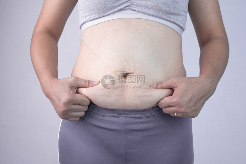 妇女肥胖肚子和超重概念图片