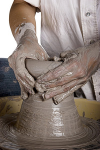 更贴近的图片一个陶艺人工作股价轮罐女士工艺图片