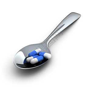 卫生保健治疗制药金属勺中的蓝色医疗胶囊图片