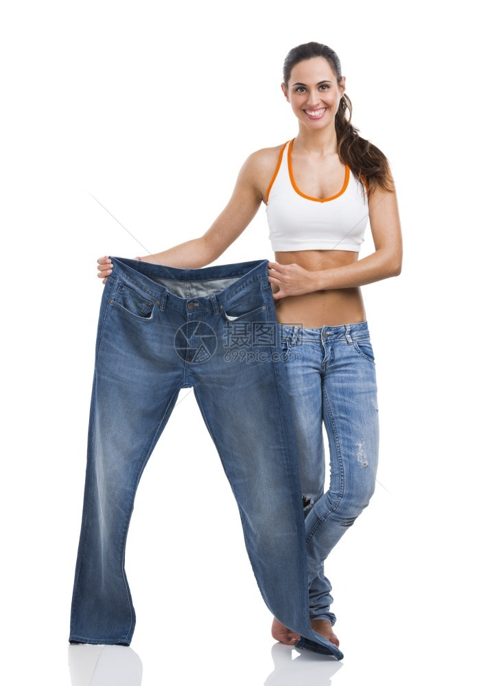 在饮食概念中穿大牛仔裤的妇女人们损失快乐的图片