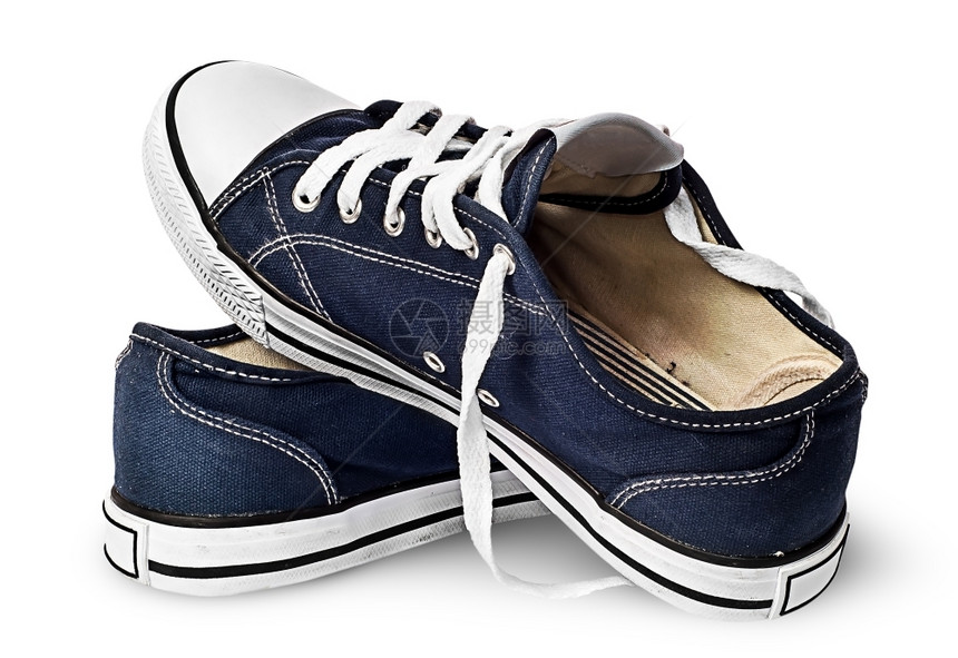 一双深蓝色运动鞋在白背景上被隔离一身彼此相隔双深蓝色运动鞋白的老式人们图片