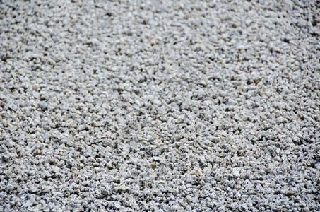 自然碎石背景在金佛寺的石园中按线排列的砾石背景安排好的有质感图片