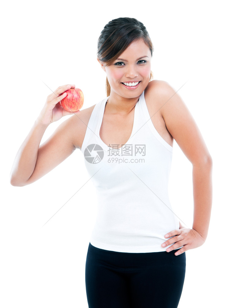年轻健身女在白色背景下装饰和展示苹果的肖像营养红色的微笑图片