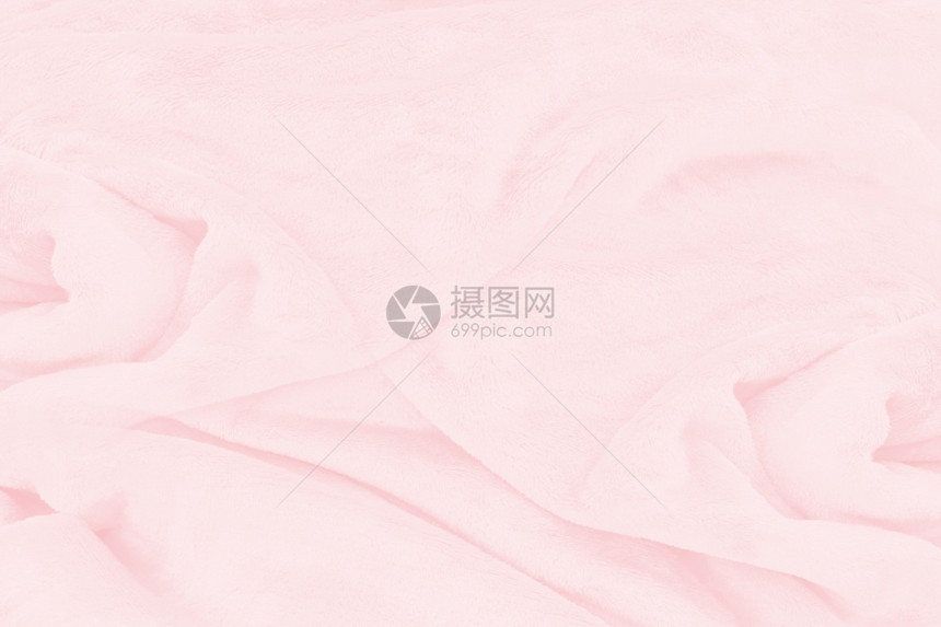 优雅的海浪缎紧贴美丽的粉红色织物纹理背景图片