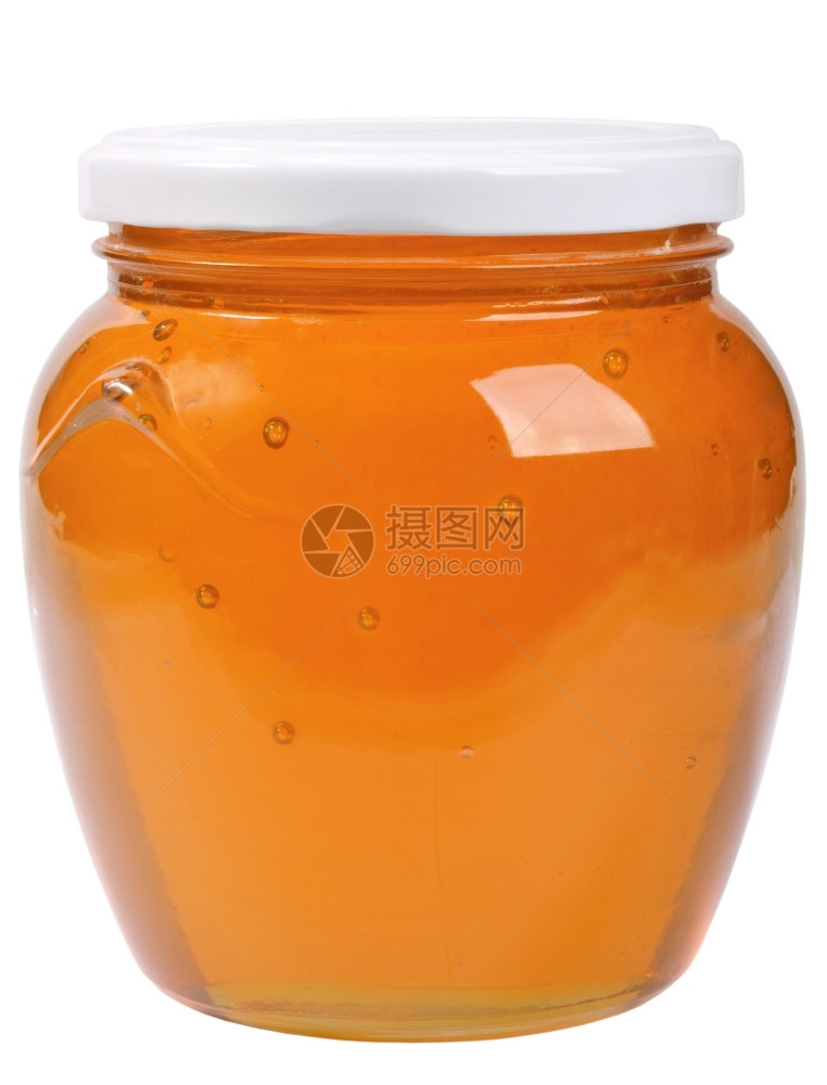 唯一个有蜂蜜的闭着玻璃罐孤立在白色背景摄影棚食物橙健康图片