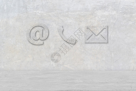 目的电话子邮件和水泥墙上的贴纸图标收件箱桌子图片
