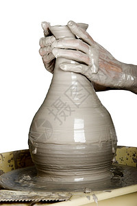 工匠更贴近的图片一个陶艺人工作股价轮垂直的陶瓷制品图片