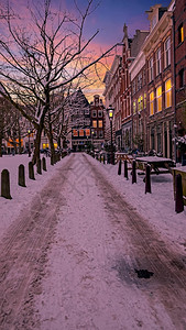 人们荷兰欧洲日落时冬季的寒下雪阿姆斯特丹城市寒冷的图片