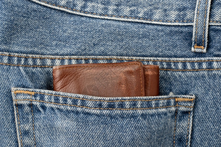 牛仔裤口袋上大块的钱包财富概念储蓄银行业笨重图片