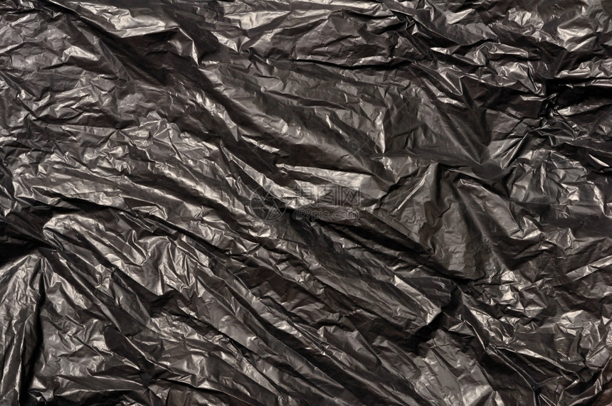 一次黑色垃圾袋塑料纹理空的皱图片