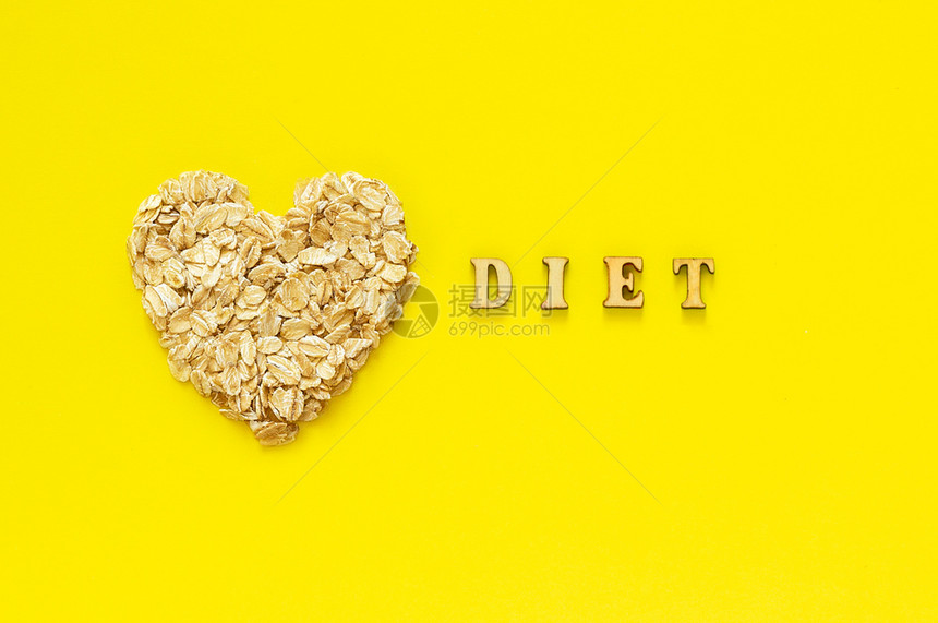 营养消化黄色的本底乙基有机饮食概念文字黄本底的面粉和燕麦片黄本底的面粉和燕麦颗粒片图片