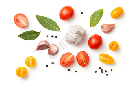 减半白背景孤立的番茄大蒜海湾叶和胡椒花素食主义者黑色的图片