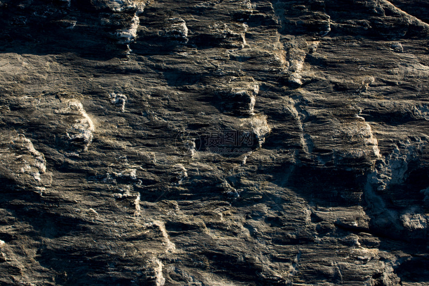 分段自然岩石或表面作为背景纹理地面抽象的图片