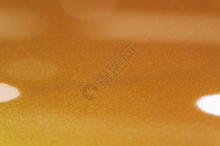 服务现代的GOLD橙色棕金属汽车油漆表面壁纸背景反射图片