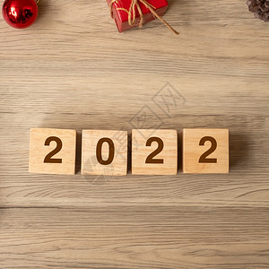 木头桌子20年新快乐圣诞奖章为新起点决议目标计划行动和任务概念礼物背景图片