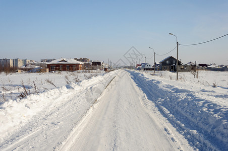 那米尔街汽车建造俄罗斯桑尼冬日俄罗斯中车道城镇的雪覆盖道路街背景