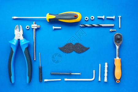 措施销售铺设一套修理用的手工具整齐地铺好蓝色背景的黑亮胡子图片