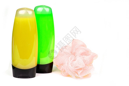 白色隔离的黄和绿彩淋浴胶水瓶和海绵保湿剂粉碎美丽图片