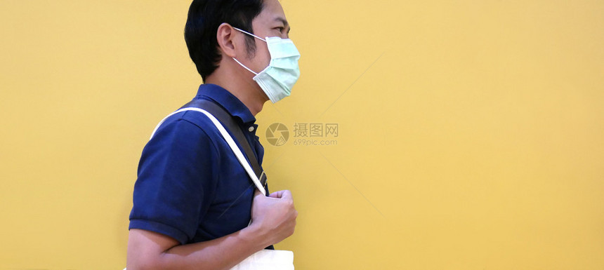 戴医疗面具以防止疾病流感空气污染世界的亚裔男子身戴医疗面具亚洲人城市健康图片