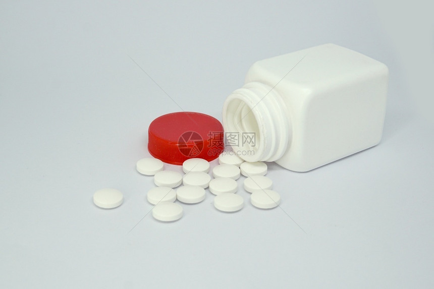 阿司匹林剂量生活白种下孤立的药瓶和丸图片