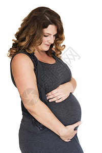 将手放在肚子上的怀孕妇女生育预期腹部图片