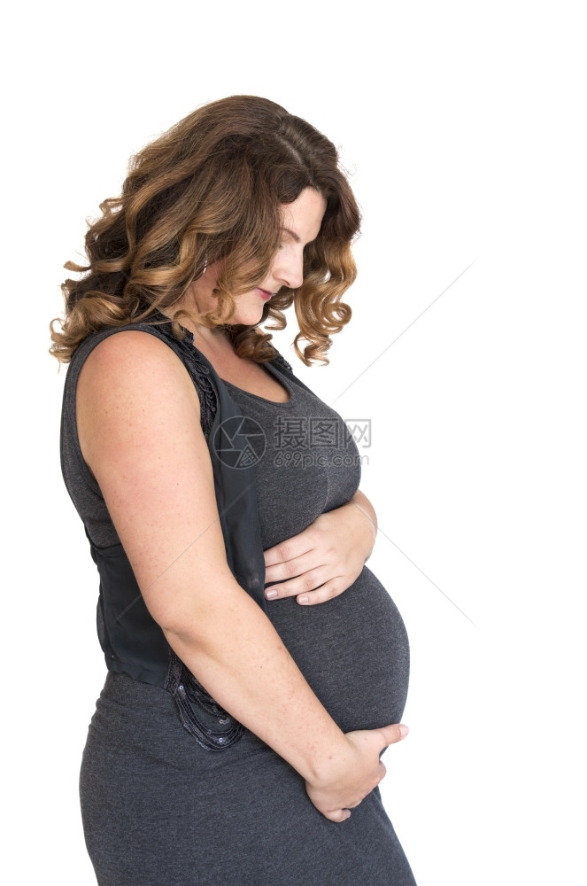 将手放在肚子上的怀孕妇女期待母预图片
