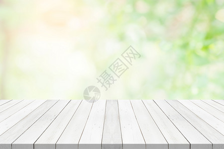 自然柜台绿色模糊背景的白桌顶用于蒙太奇产品的空间桌上图片