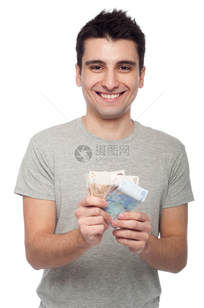抓住喜悦英俊的带着微笑年轻男子展示自己的钱财在白色背景上孤立的欧元账单图片