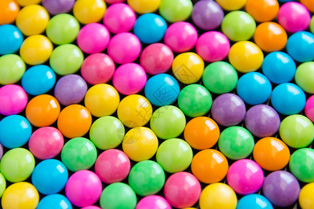 彩色甜糖巧克力花彩夹层涂有色背景的收藏品变化食物绿色图片