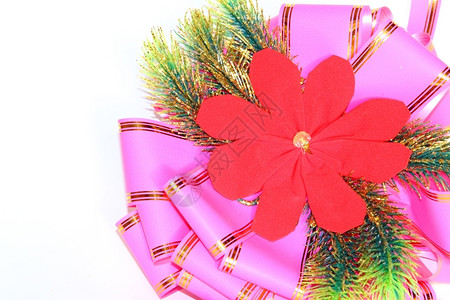 十二月圣诞锡和粉色弓明亮的丝带图片