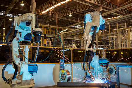 工业机器人是汽车厂部分的焊接组装技术工程机械的背景图片