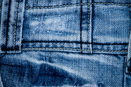 穿质地蓝色牛仔裤纺织品的纹理蓝色牛仔裤纺织品的纹理城市图片