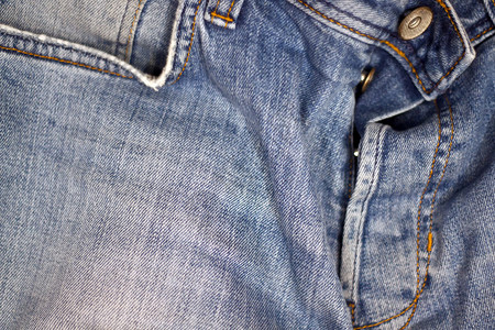 缝纫棉布蓝色牛仔裤纺织品的纹理蓝色牛仔裤纺织品的纹理图片
