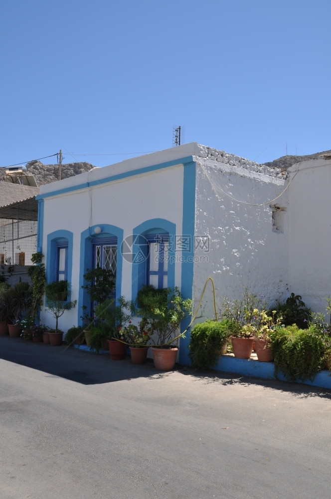 白色的希腊卡利姆诺斯岛的希腊小屋花朵鲜乡村地中海图片