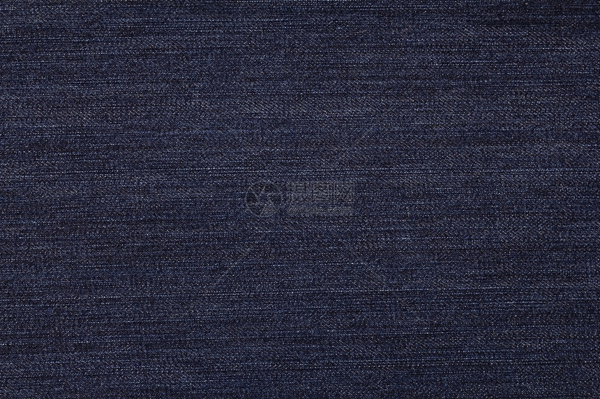 接缝深蓝色牛仔裤的织物纹理风格空白的图片