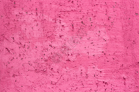 墙上涂有粉色背景纹理的粗糙装饰石膏制造有质感的城市图片