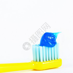 牙刷上的牙膏背景图片