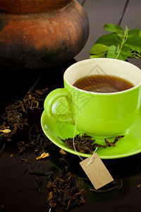 茶点植物水木本底的绿茶杯热背景图片
