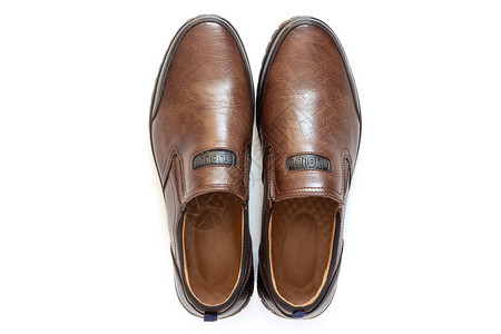 新的干净衣柜Demiseason棕色皮鞋白背景与世隔绝的男皮鞋顶视图片