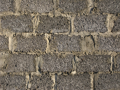 卵石灰水泥块墙壁可作为背景家户外图片