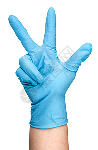 戴蓝色乳胶手套的医生图片