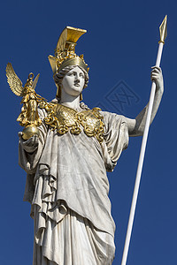 雅典娜女神谁希腊语欧洲奥地利议会是的两院制立法机构由国民议会和联邦委员组成雕像是智慧女神AthenaShe身着长袍和盔甲戴着头她的左手拿着背景
