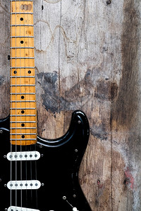 黑色电吉他木本底的黑电吉他细节泰国乐器优质的图片