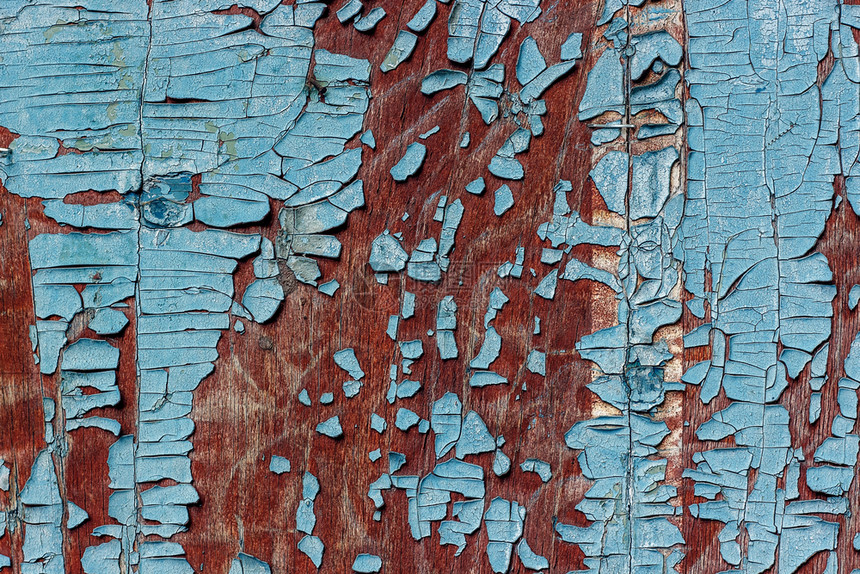 木材画脱皮棕色的旧木头表面上有剥光的蓝色涂料纹理图片