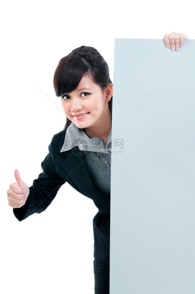 公司的亚洲人一位年轻商业女人在白背景下举起拇指手势和持有空白广告牌的肖像保持图片