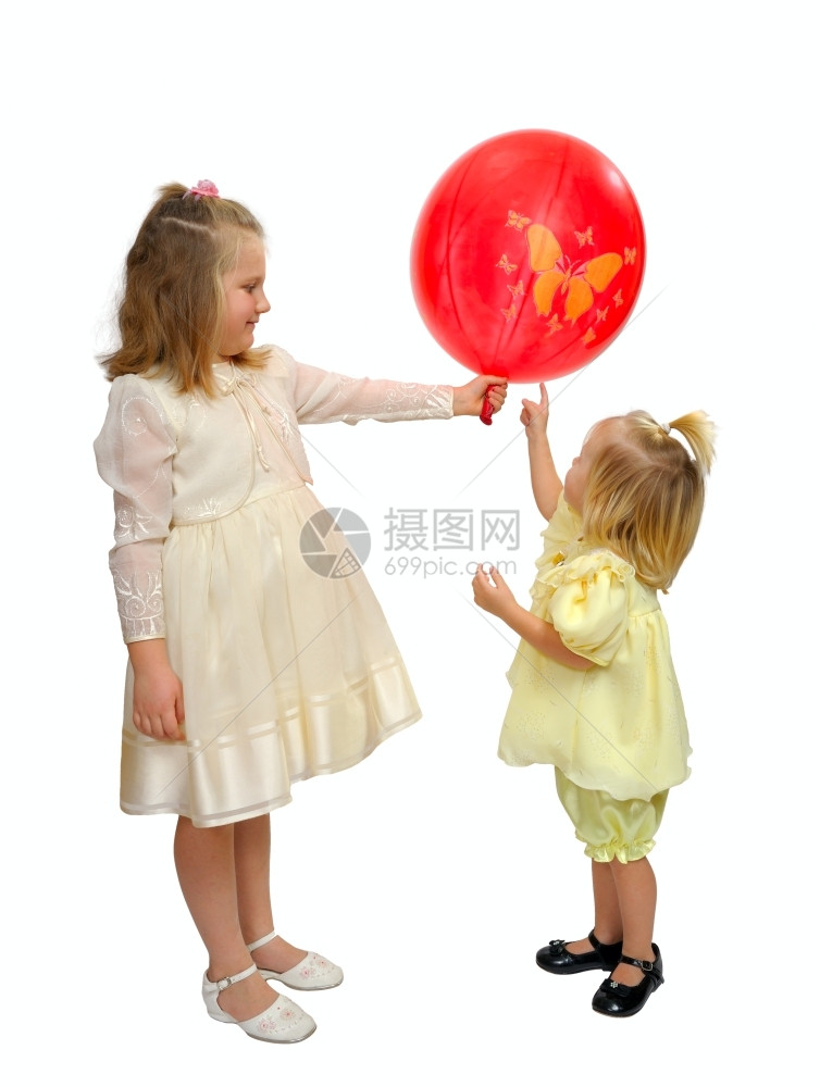 穿着漂亮裙子的女孩玩红气球白种人色的包图片