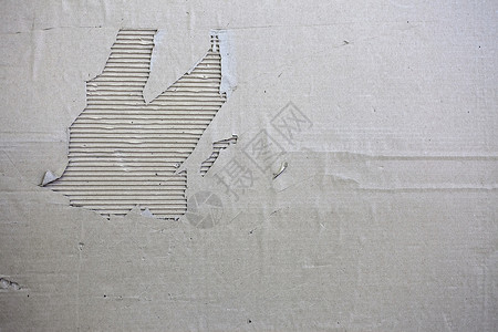 撕裂旧的破纸板横幅在单色熔化的撕破纸板横幅上以单色简棕的图片